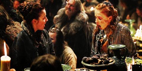 Sansa with food on her face looking shocked at the Winterfell feast in Game of Thrones