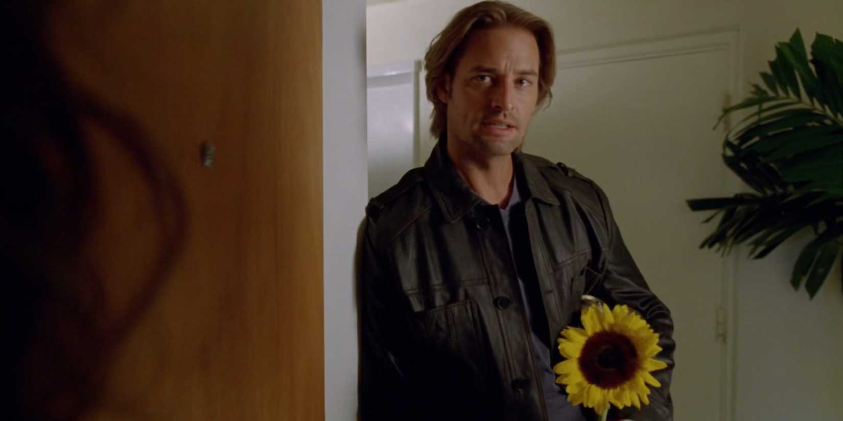 Sawyer holding a big flower in Lost