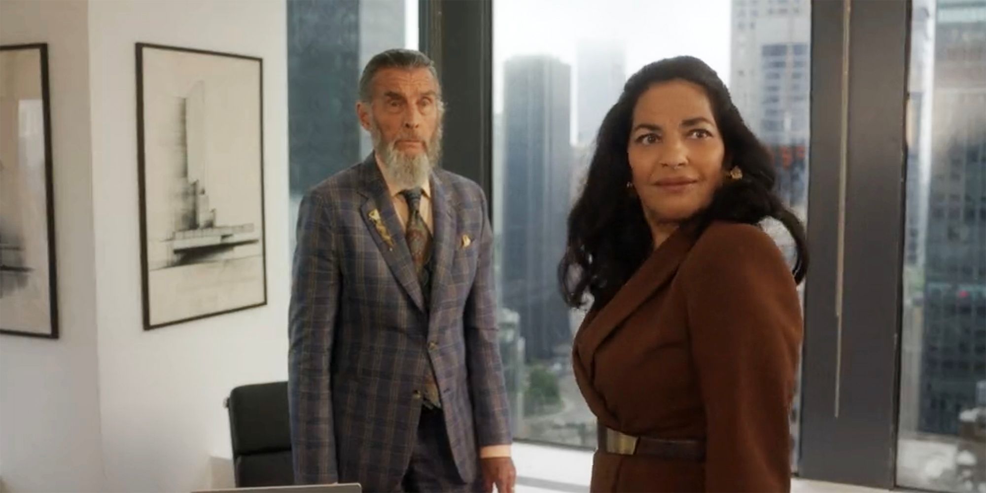 Seema looks over her should standing next to Elliot in And Just Like That season 3