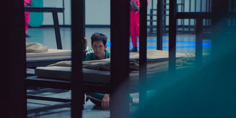 Seong Gi-hun (Lee Jung-jae) watching from afar in Squid Games Season 3 Ep 1