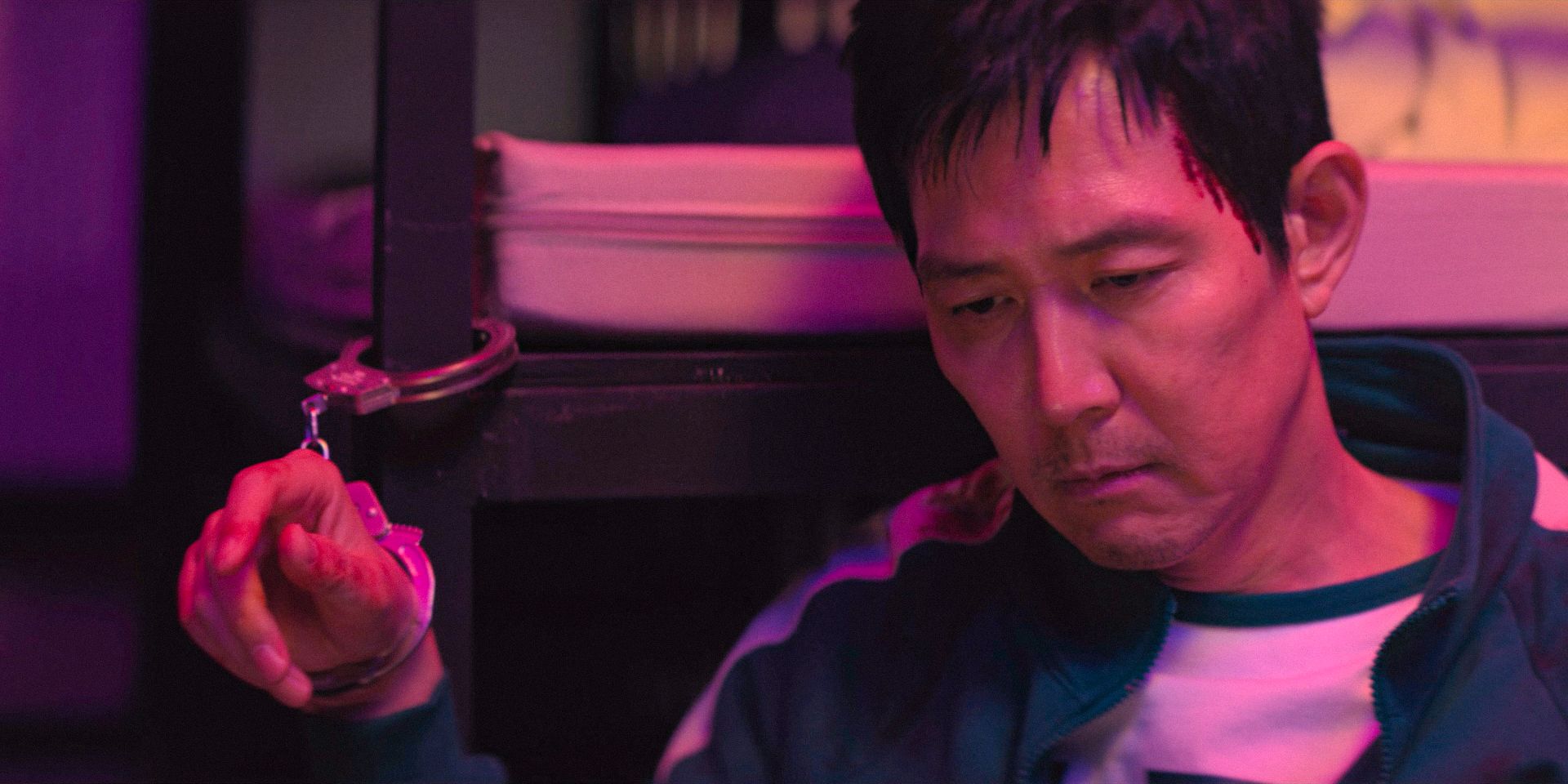 Seong Gi-hun (Lee Jung-jae) handcuffed to a bed in Squid Games Season 3 Ep 1