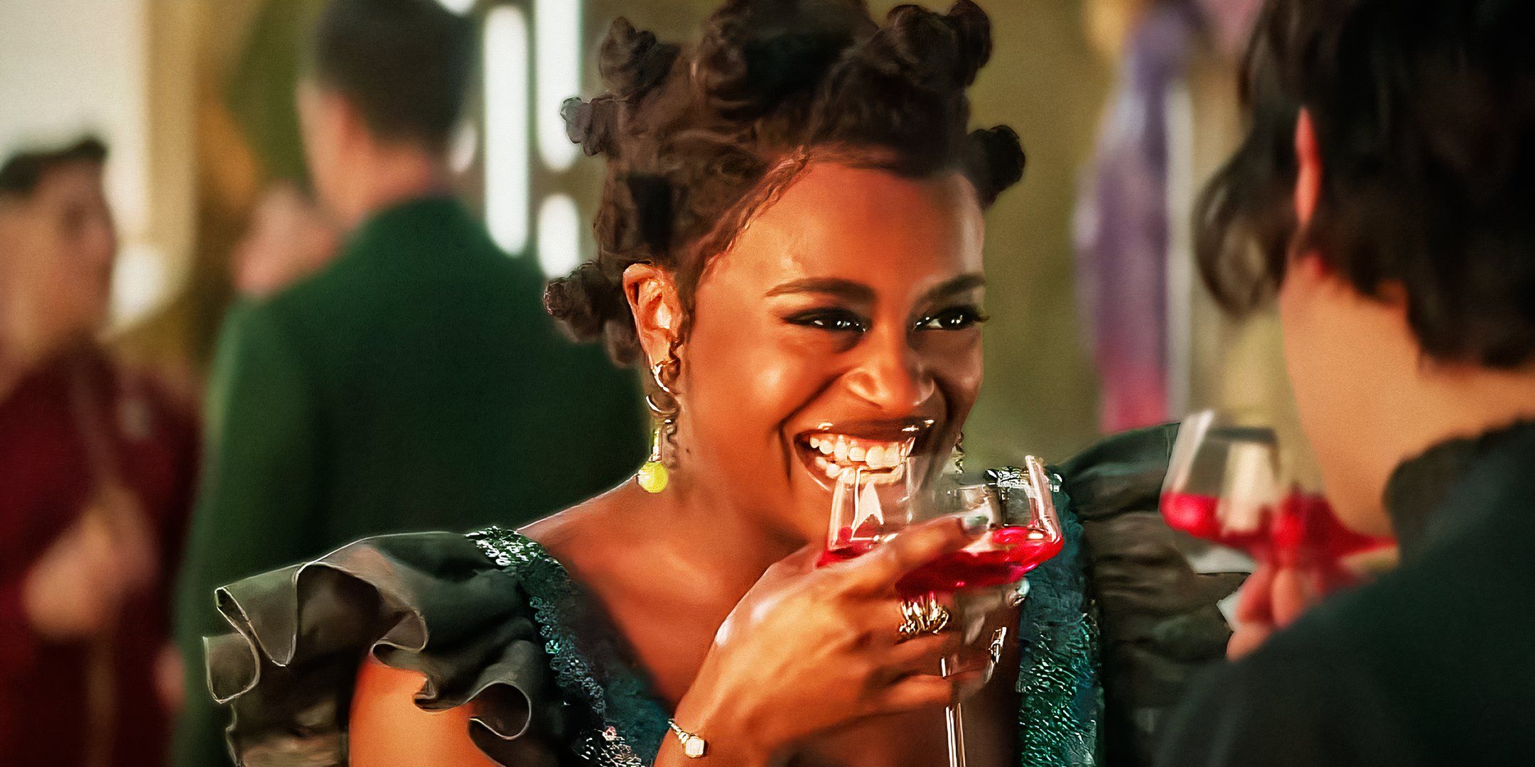 Uhura laughing with a drink in Star Trek: Strange New Worlds season 3
