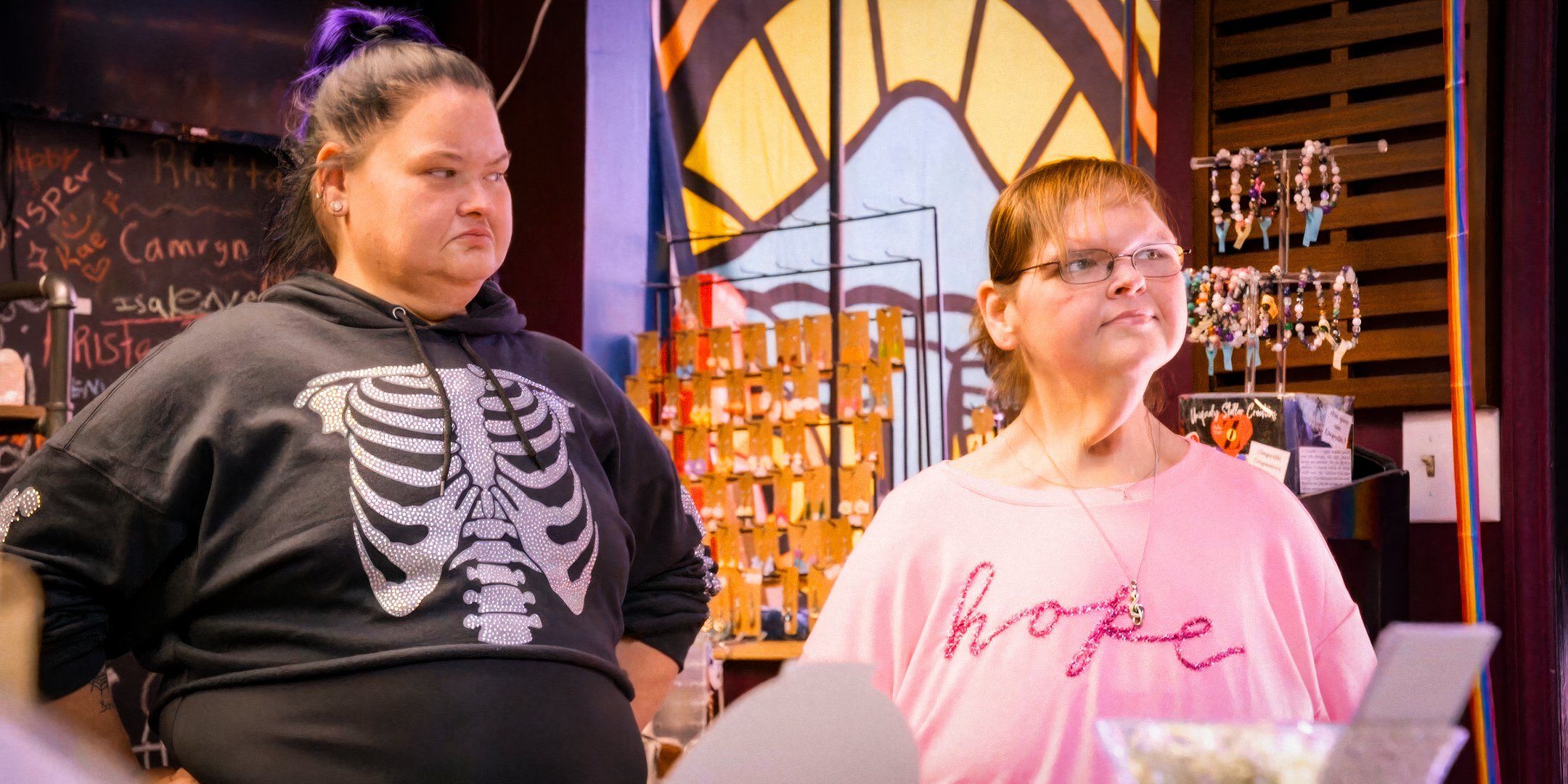 Tammy in pink shirt and Amy Slaton in black shirt 1000-Lb Sisters standing together