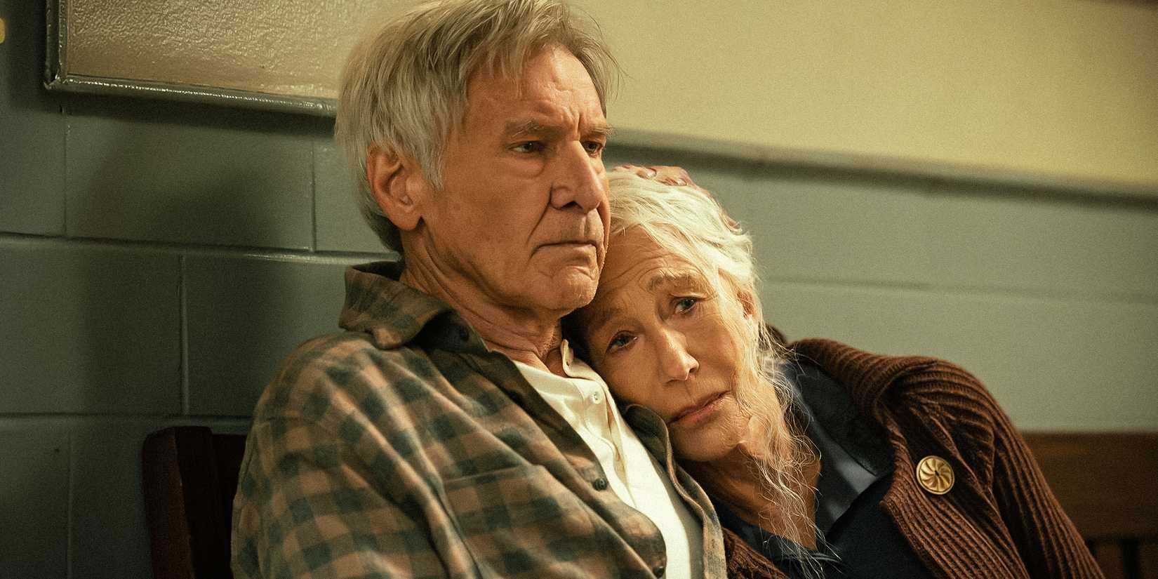 Harrison Ford as Jacob Dutton and Helen Mirren as Cara Dutton comforting one another in 1923