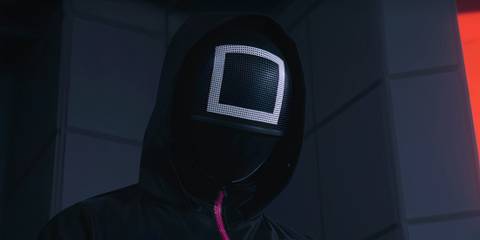 The Masked Officer looking down in Squid Game season 2