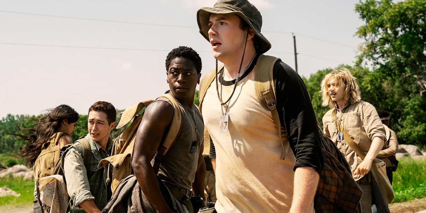 Cooper Hoffman and other boys turning around and looking shocked in The Long Walk