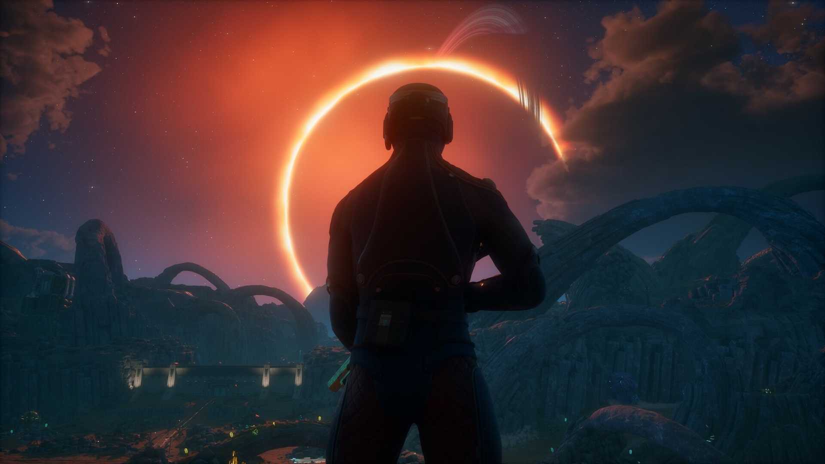 The outer worlds 2 character in the shadow standing with a glowing ring in the sky in front of them