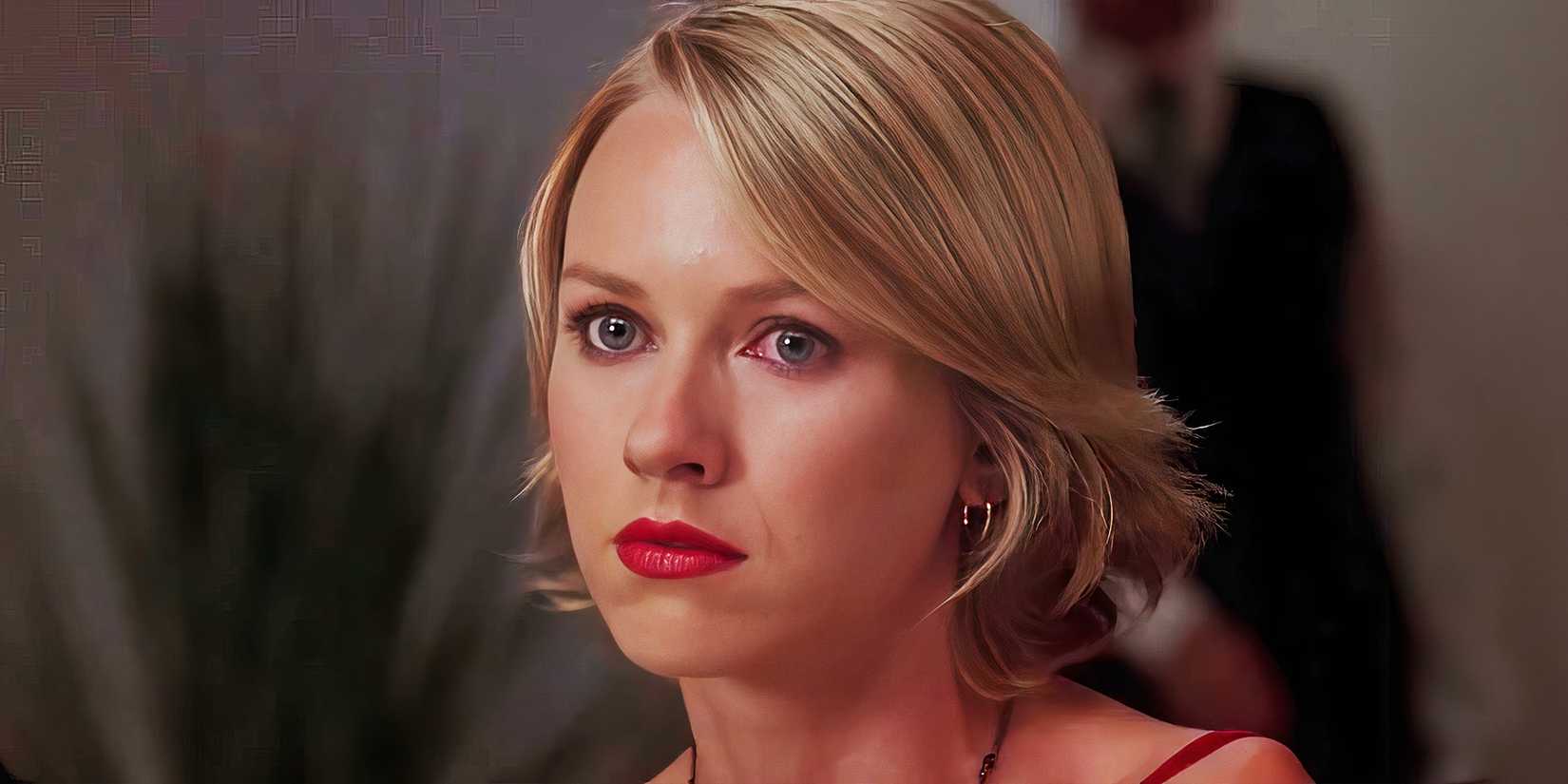 Naomi Watts looks ahead with a serious expression on her face.
