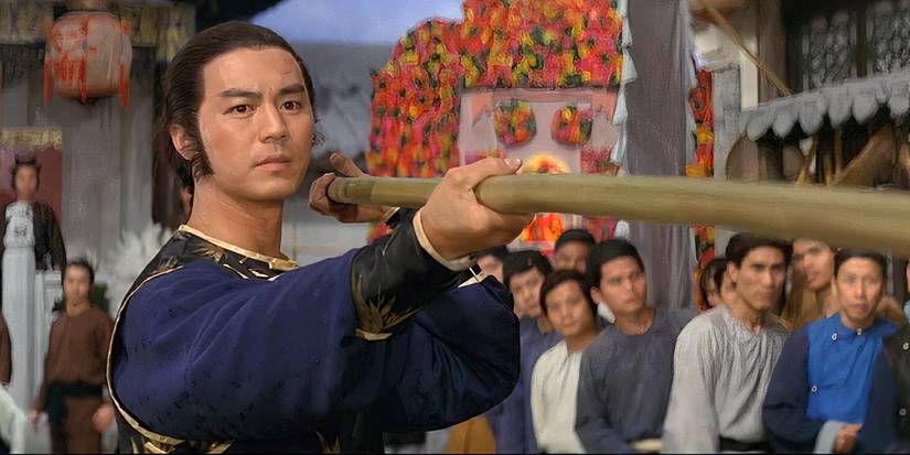 Ti Lung fights with a staff in Opium and the Kung Fu Master