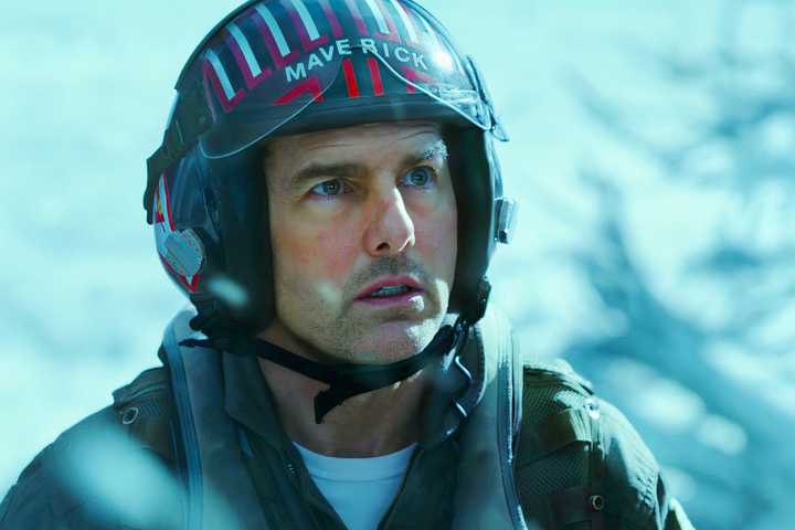 Tom Cruise looking worried in a snowy environment as Maverick in Top Gun Maverick