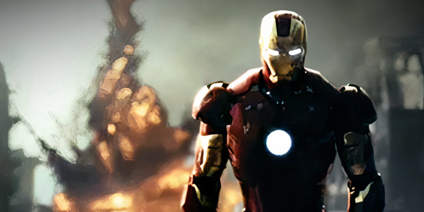 Tony Stark si allontana dall'esplosione di un serbatoio in Iron Man (2008)