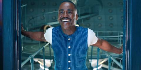 Ncuti Gatwa smiling in the TARDIS doorway as the Fifteenth Doctor in Doctor Who