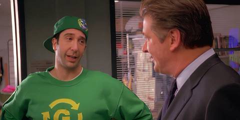 Alec Baldwin as Jack Donaghy talking to David Schwimmer as Greenzo/Jared outside Liz's office in the 30 Rock episode 