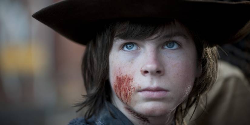 TV Shows That Struggled After Losing Main Cast Members 18 Carl Grimes with scratches on his face wearing Rick's hat in the Walking Dead