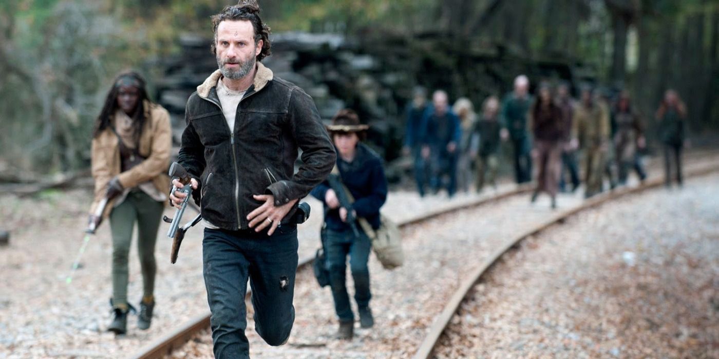 Rick, Carl, and Michonne run from walkers on The Walking Dead