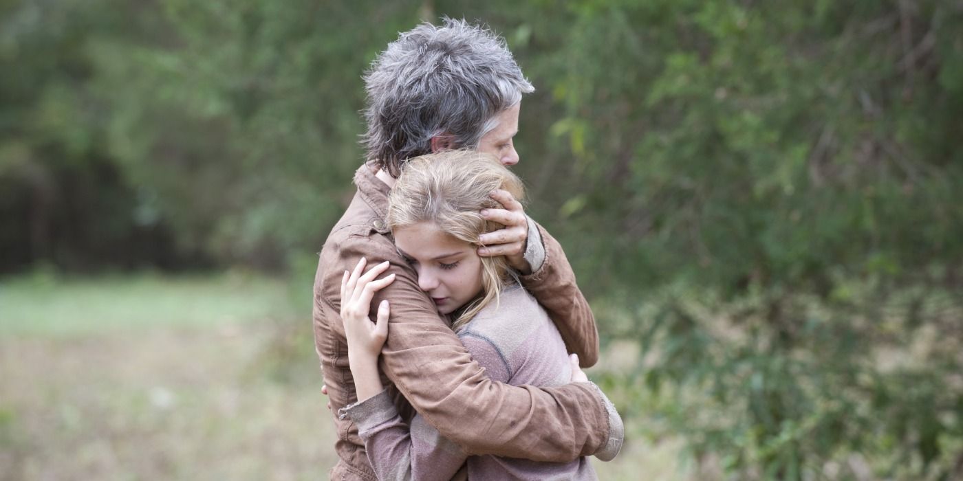 Lizzie and Carol hug in The Walking Dead