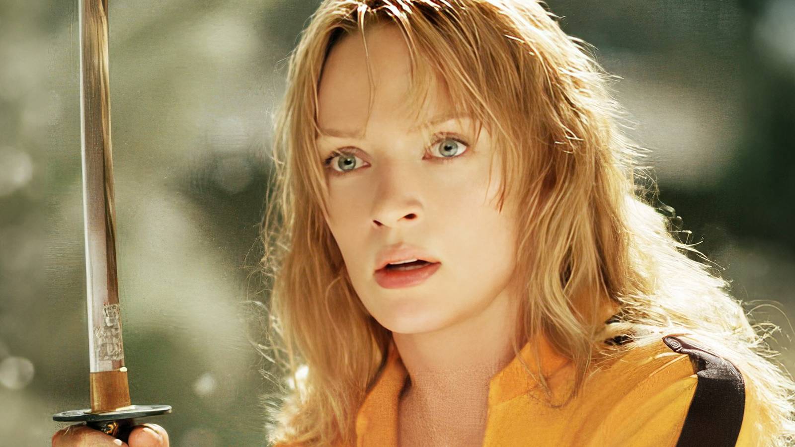 Uma Thurman as The Bride holding a sword in Kill Bill.