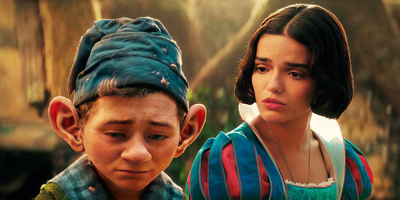 Snow White looks sympathetically at a sad Dopey in Snow White