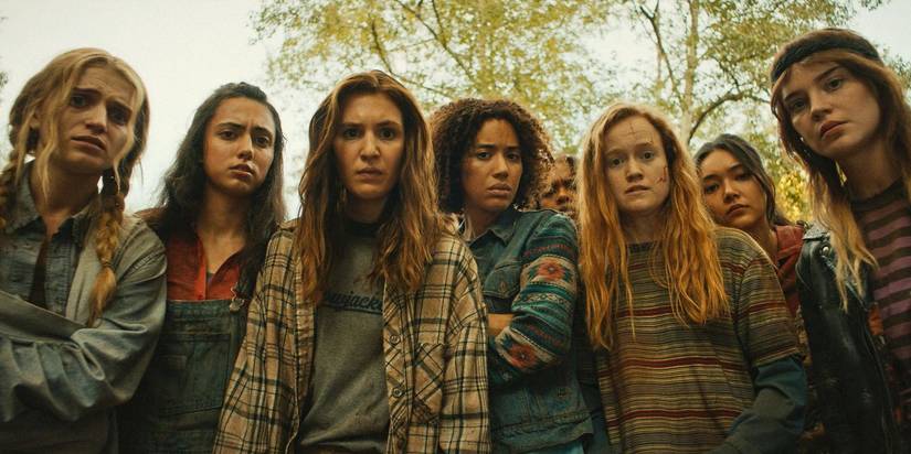 Yellowjackets teens looking down at Hannah in Yellowjackets season 3