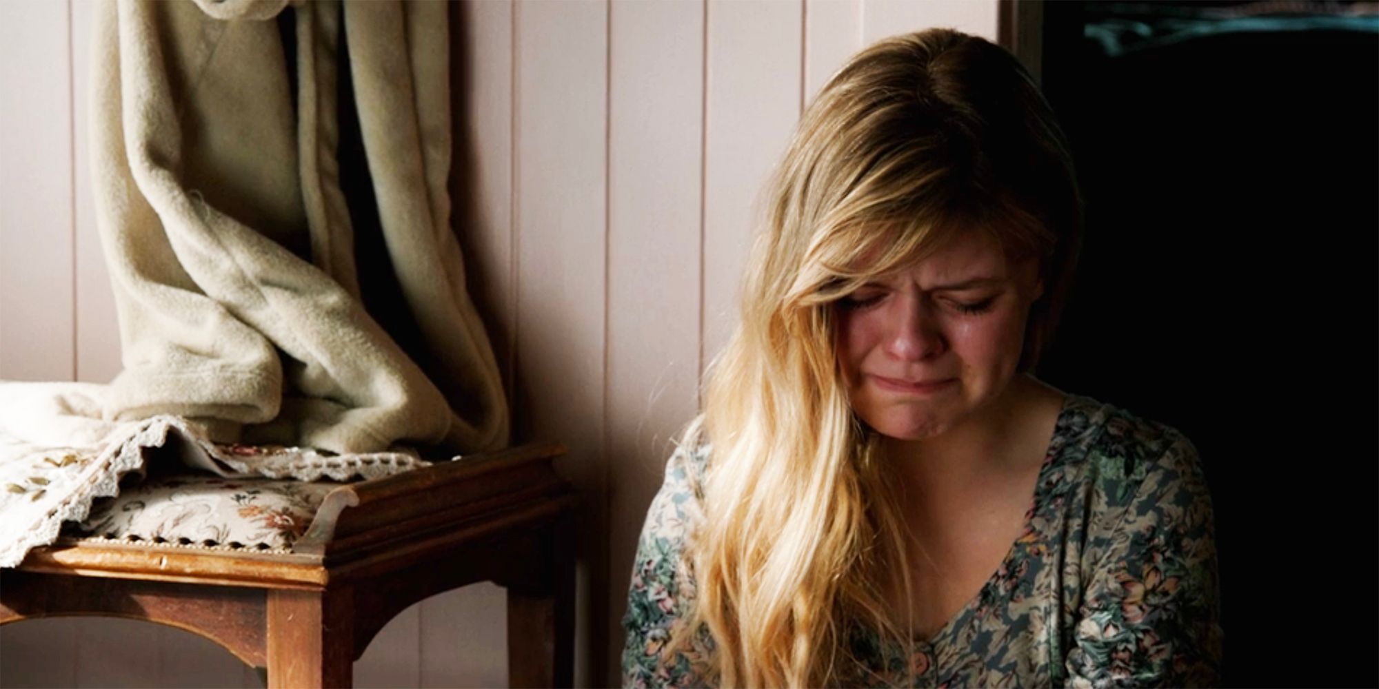 Young Beth cries on the bathroom floor in Yellowstone