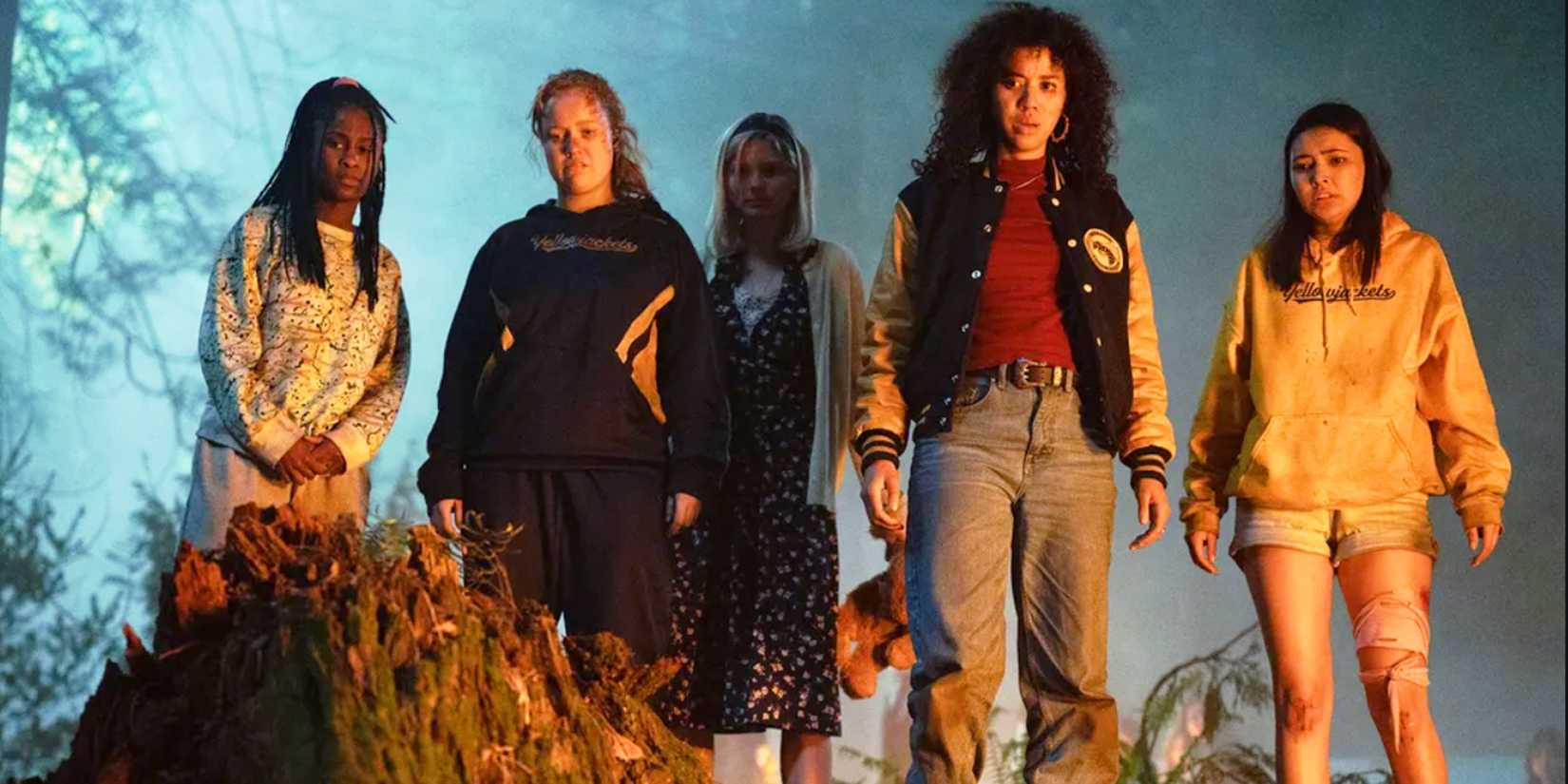 Young Cast of Yellowjackets Standing in the Forrest