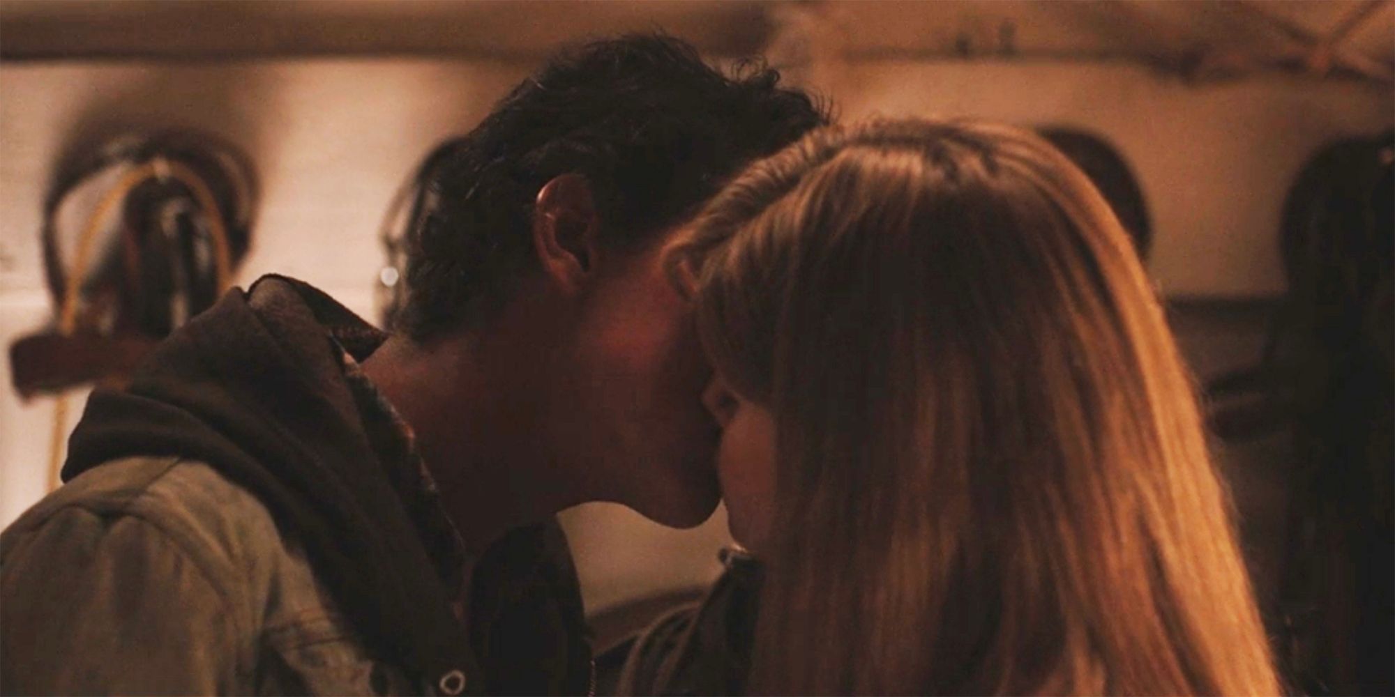 Young Rip and Beth kiss in Yellowstone