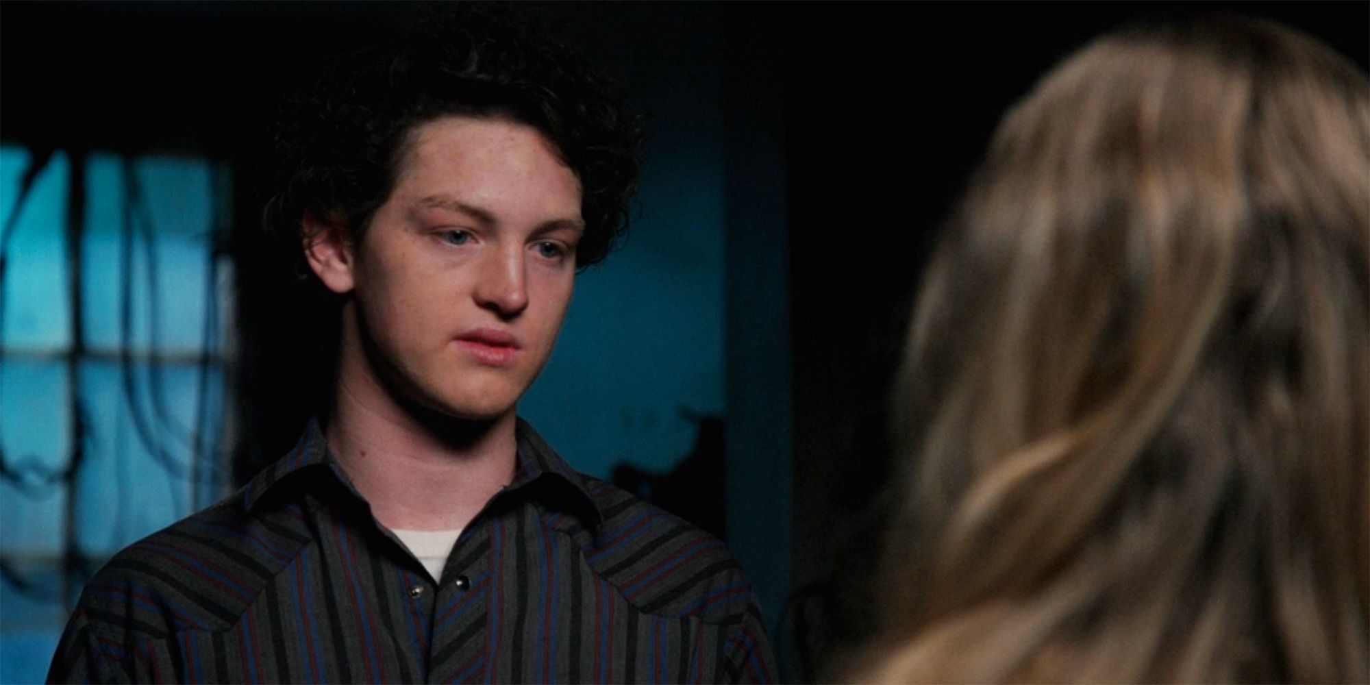 Young Rip with teary eyes looks at Young Beth in Yellowstone