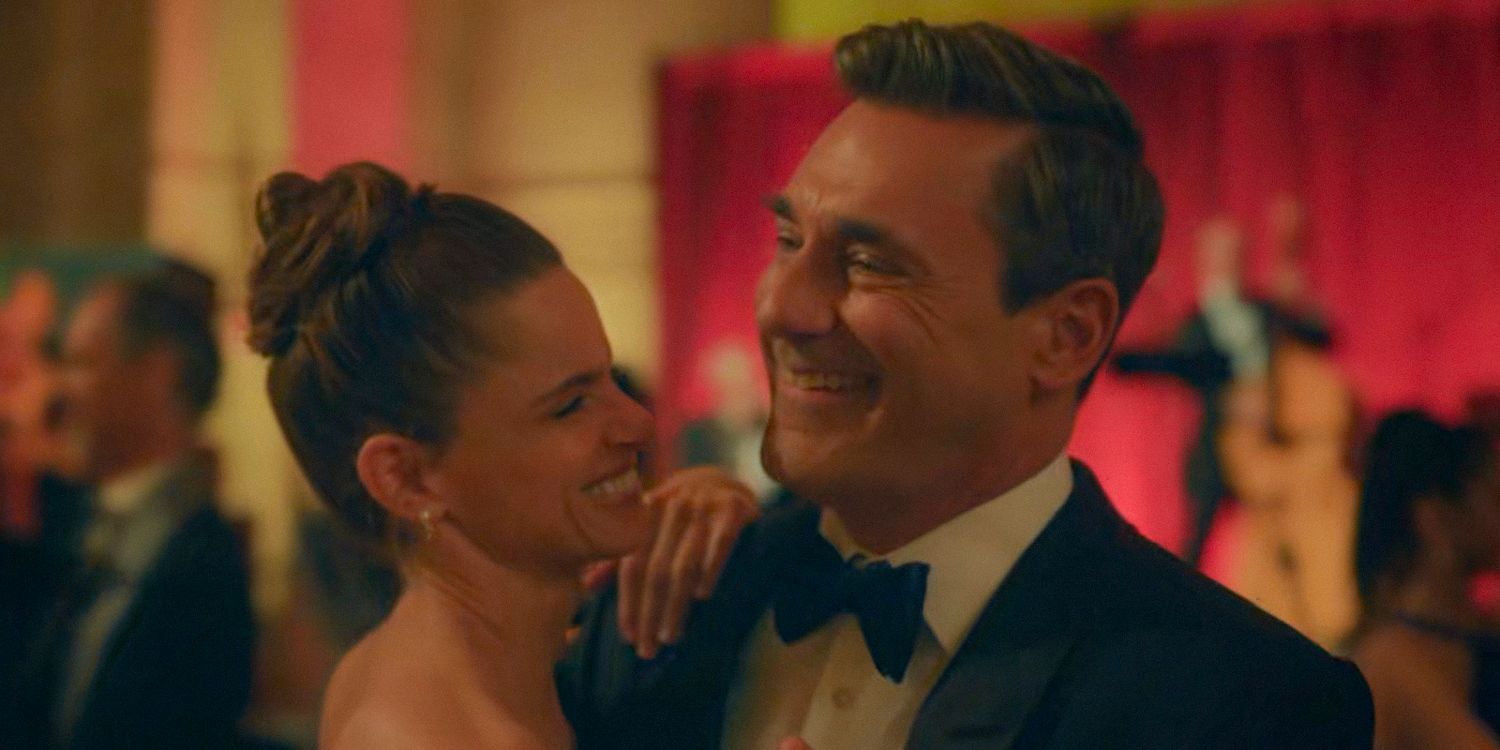 Mel Cooper (Amanda Peet) and Andrew Cooper (Jon Hamm) dancing and laughing in Your Friends and Neighbors Season 1 Ep 9