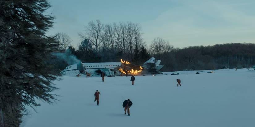 Fugitives running away from a crashed plane in the snow in The Last Frontier.