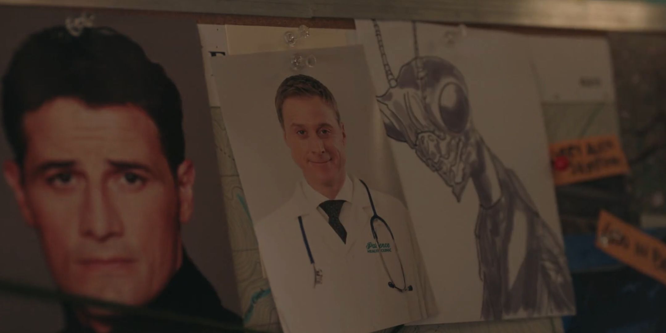 A murder board in Resident Alien with Joseph, Harry and the Mantid