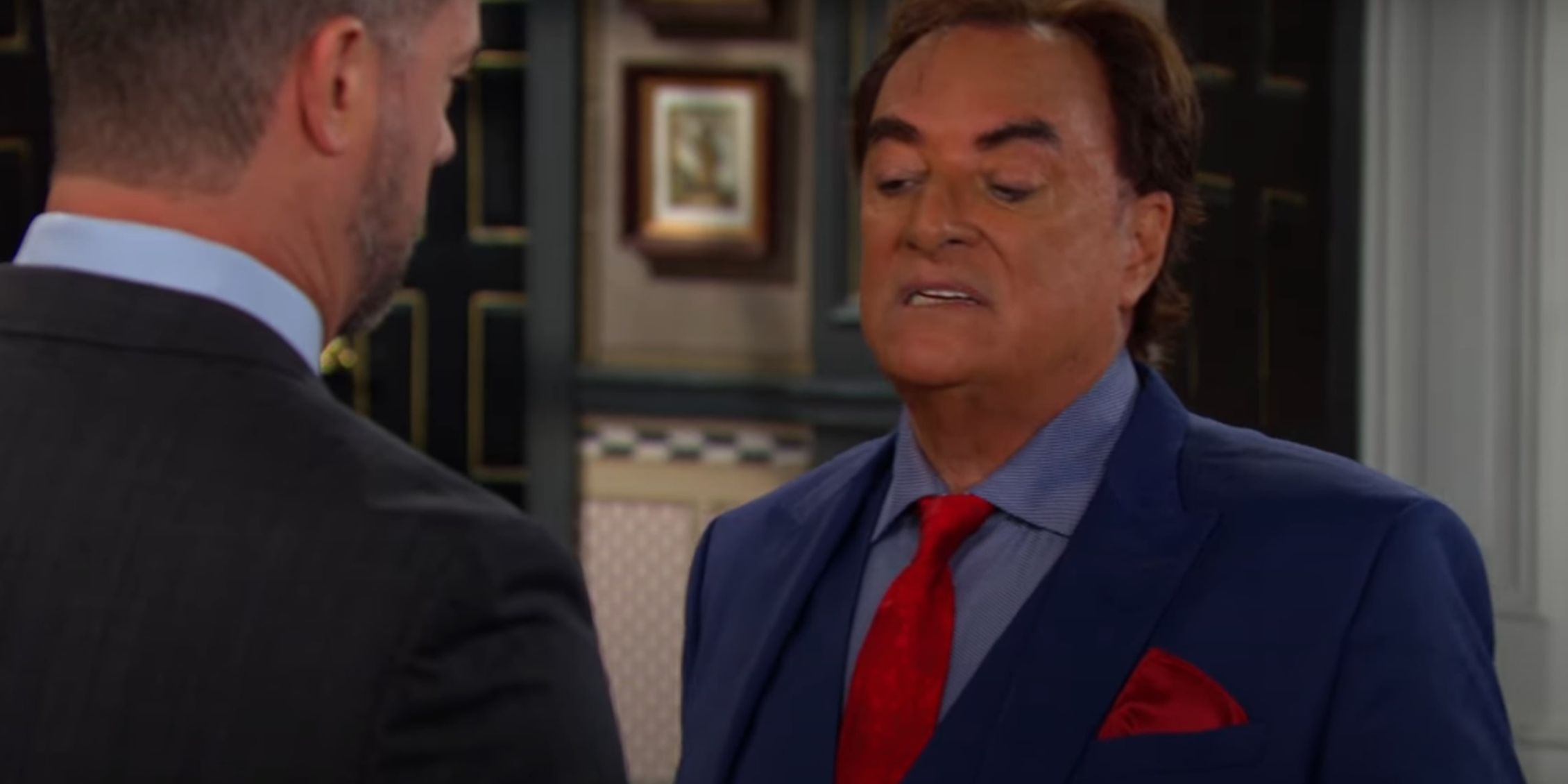 Tony facing EJ and talking to him in a blue suit and red tie in Days of Our Lives