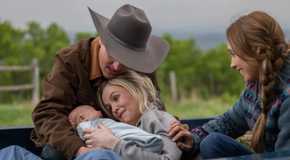 A woman after giving birth to her new baby in the back of a truck in Heartland