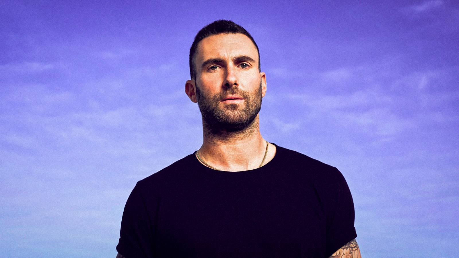 The Voice's Adam Levine looks at the camera with a serious expression