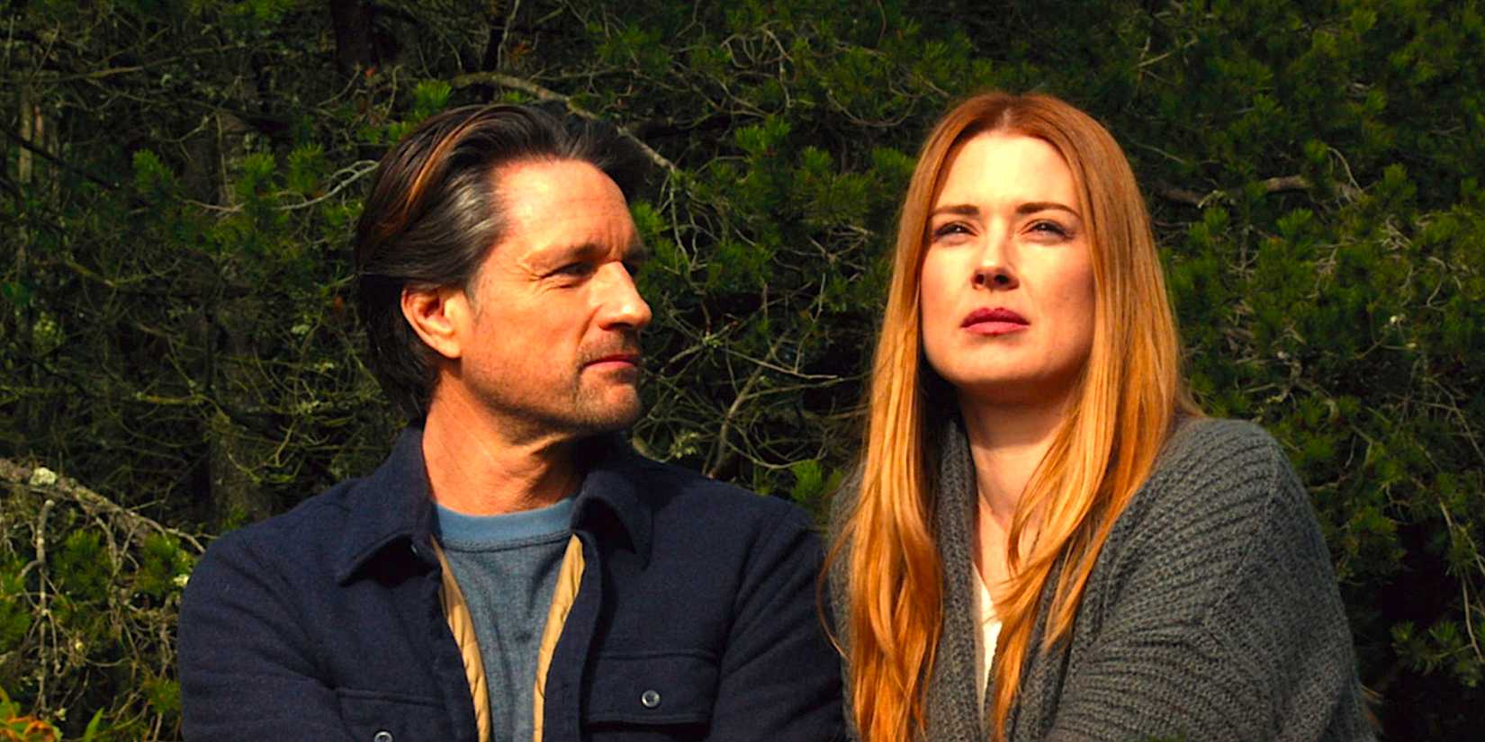 Alexandra Breckenridge's Mel and Martin Henderson's Jack sit outside from Virgin River