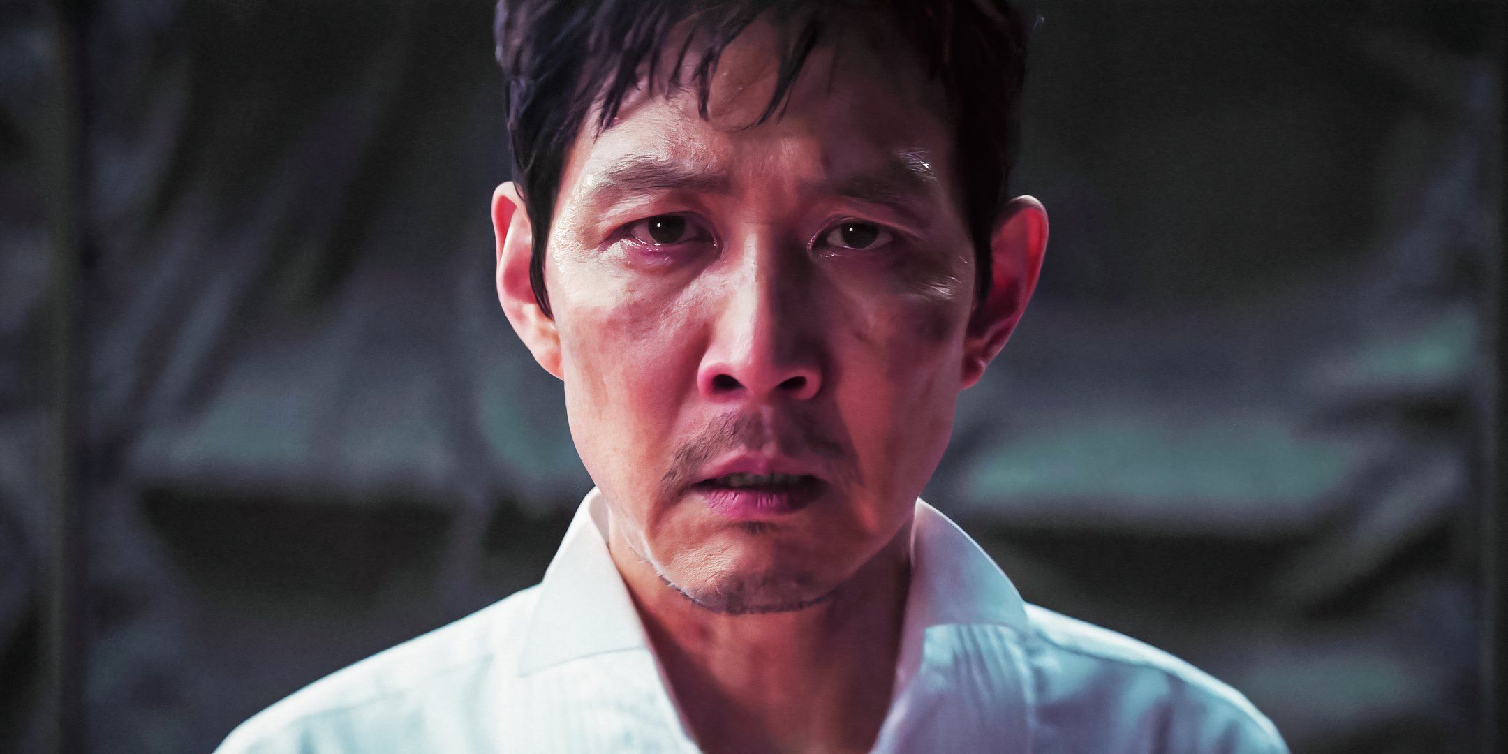 Lee Jung-jae as Gi-hun looking into the camera with teary eyes in Squid Game season 3's finale