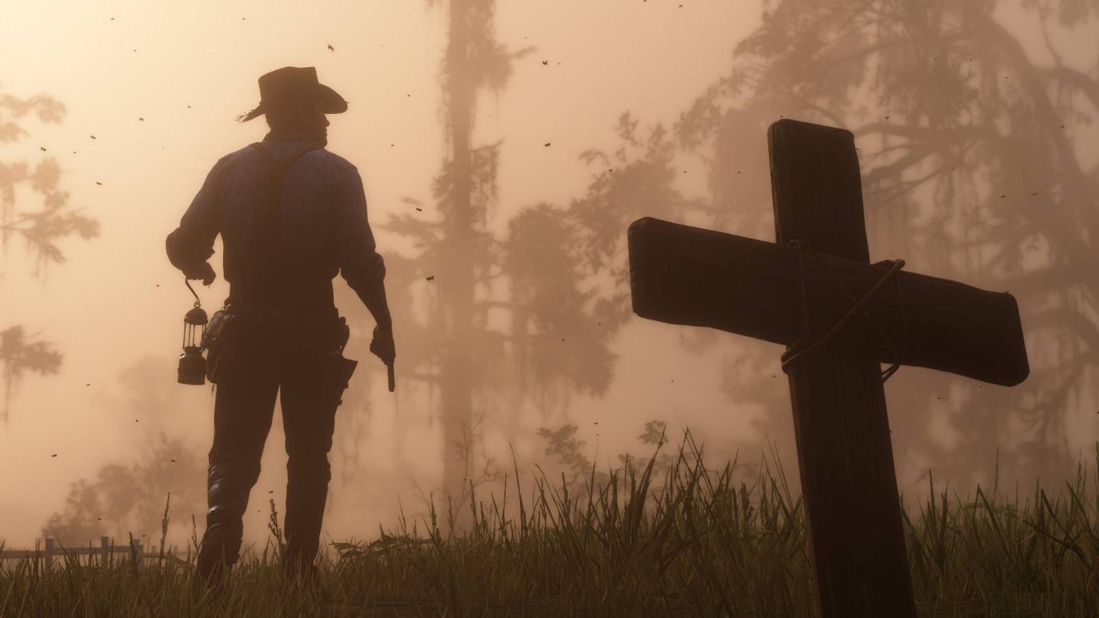 Arthur Morgan with his back to the camera and a cross in the forgeound in Red Dead Redemption 2