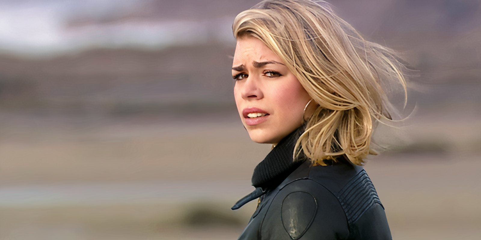 Billie Piper as Rose Tyler looking upset while standing on Bad Wolf Bay in the Doctor Who episode 