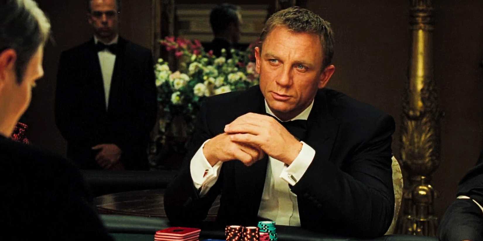 Bond sits with his hands folded at the gaming table in Casino Royale