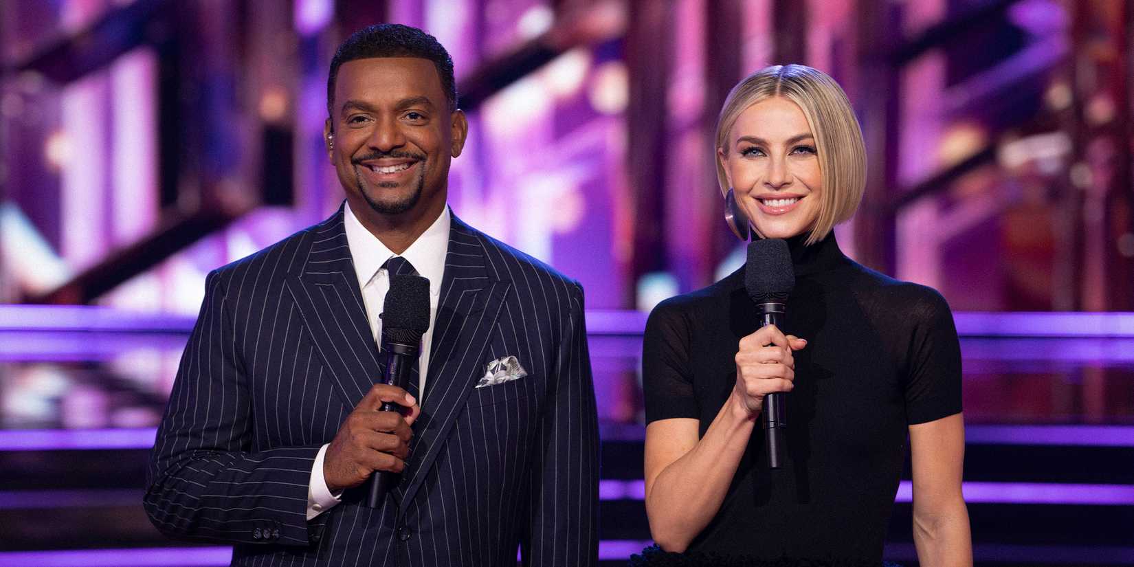 Dancing With The Stars Season 34 two cast members smiling and holding mics