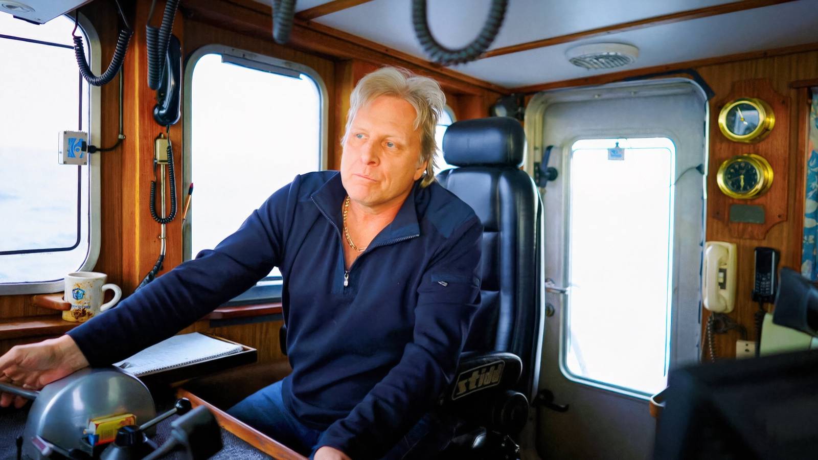 Deadliest Catch Sig Hansen inside cabin wearing blue hoodie
