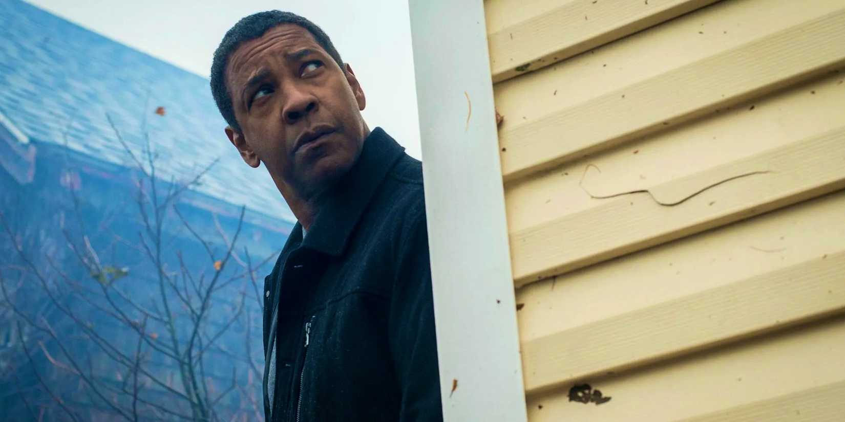 Denzel Washington as McCall looking from behind cover in The Equalizer 2
