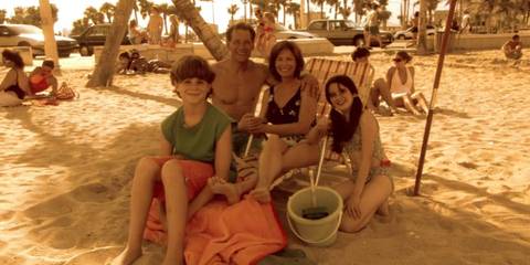 The Morgan family posing for a picture on the beach in Dexter season 1, episode 4