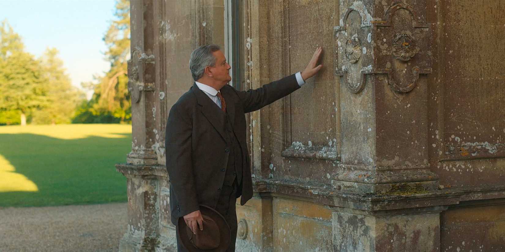 Robert presses his hand to the side of the Abbey in Downton Abbey: The Grand Finale