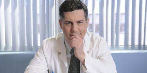 Dr Spaceman (Chris Parnell) sitting in his office in 30 Rock