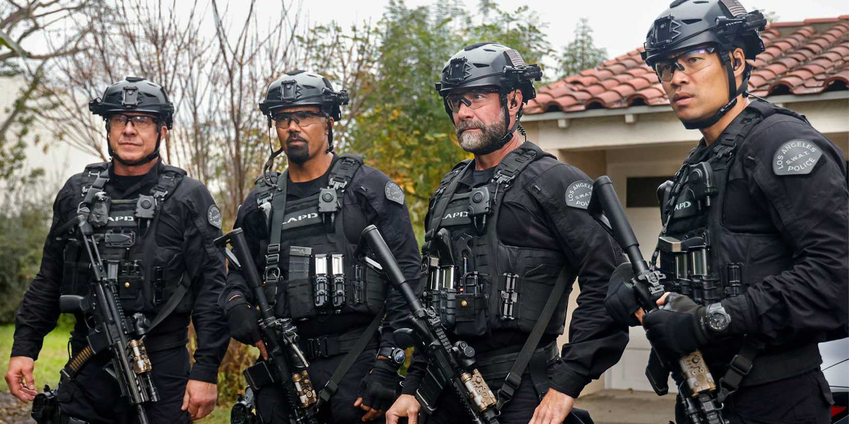 Four members of the S.W.A.T. cast in tactical gear.