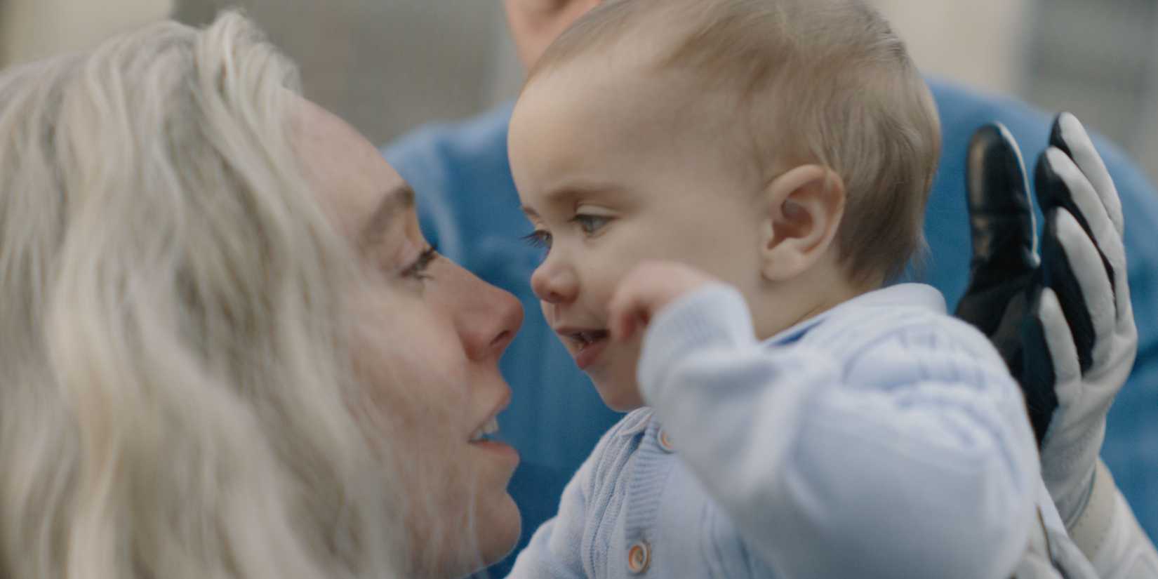 Franklin Richards with his mother Sue Storm in The Fantastic Four_ First Steps
