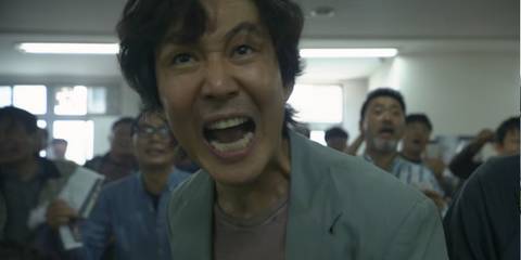 Gi-hun at horse races in Squid Game episode 1 
