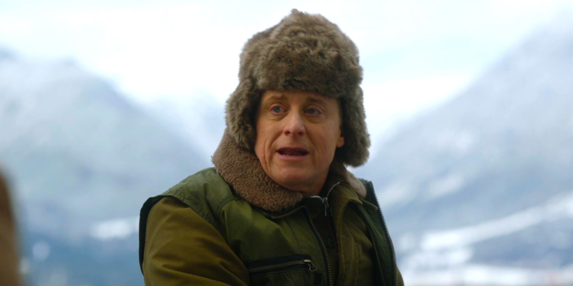 Harry wearing a jacket and hat on a boat with Bridget in Resident Alien season 4 episode 5