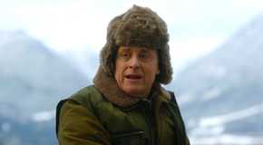 Harry wearing a jacket and hat on a boat with Bridget in Resident Alien season 4 episode 5