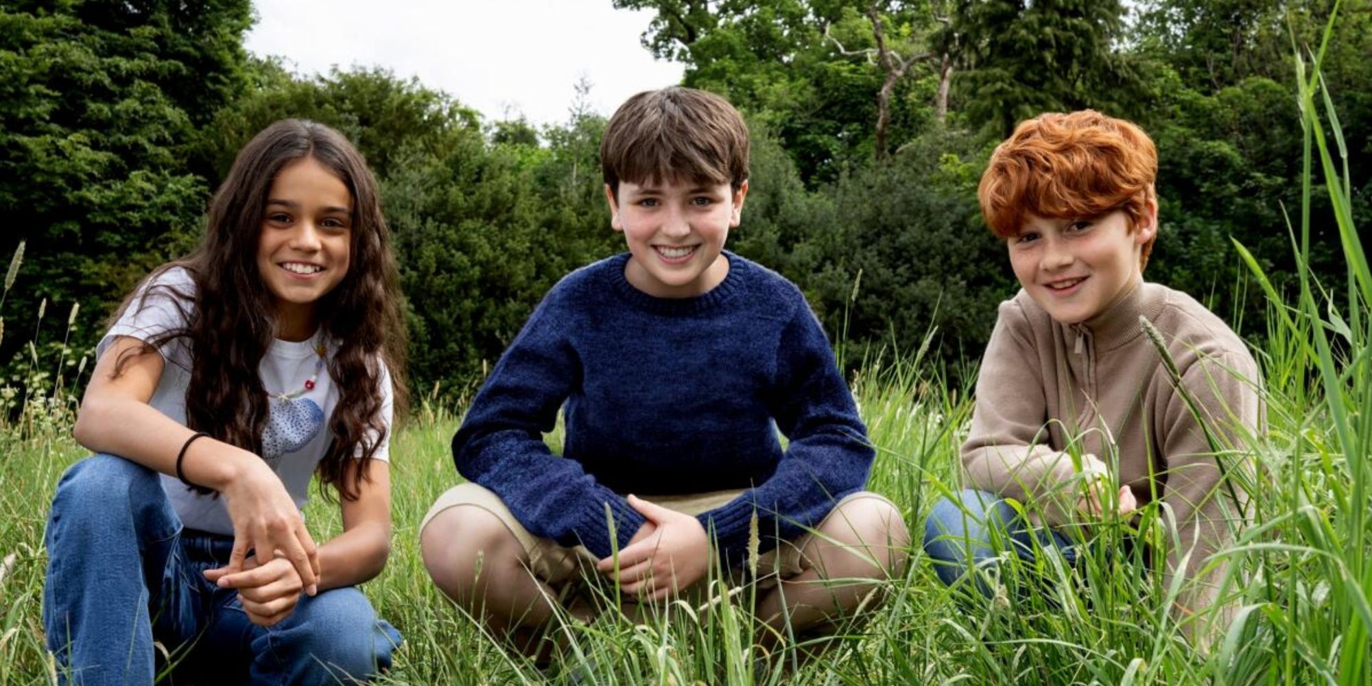 Hermione, Harry e Ron sorridenti durante le riprese della serie Harry Potter